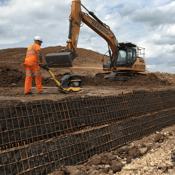 Tensar’s Basetex geotextile and Tensartech Greenslope system being used to steep-sided rail overbridge embankment